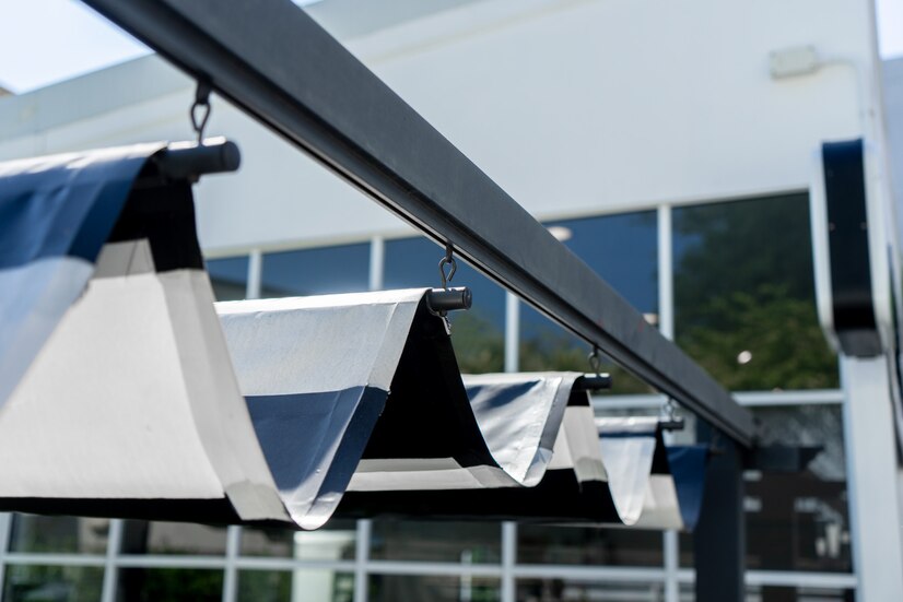 retractable-awning-roof-protect-sun-garden_51665-555 retractable shades for patio