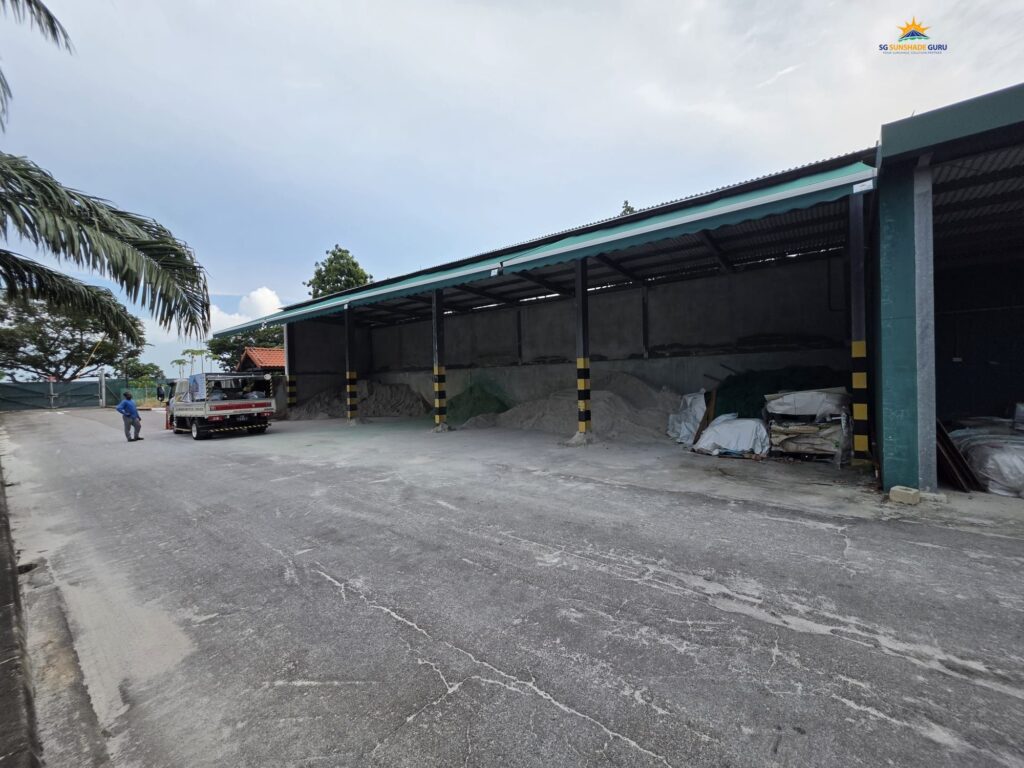 Motorized retractable awning system installed at an industrial facility by SG Sunshade Guru in Singapore.