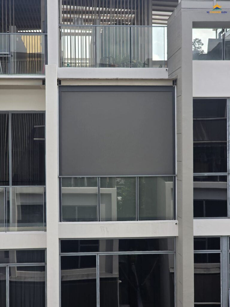 Motorized zip blind installed on an outdoor balcony for sun protection and privacy.