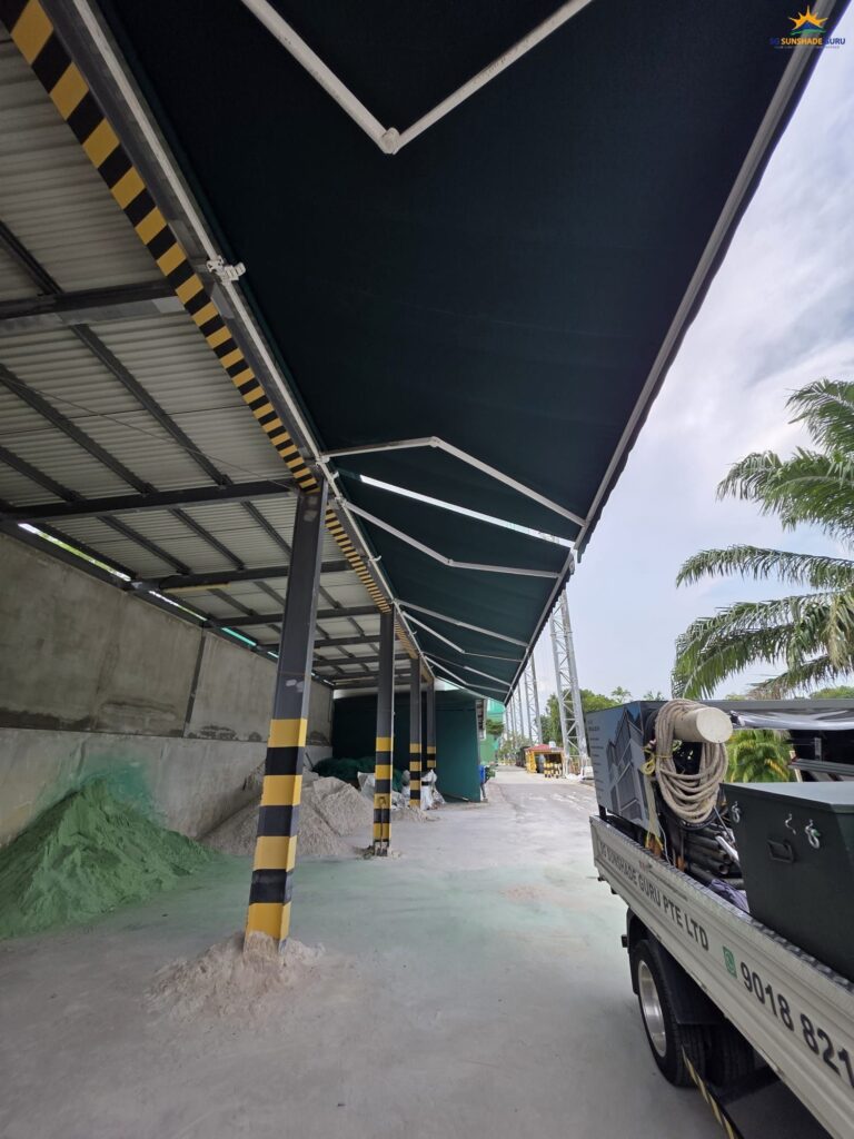 Outdoor retractable awning installed for a warehouse project to provide shade and rain protection in Singapore.