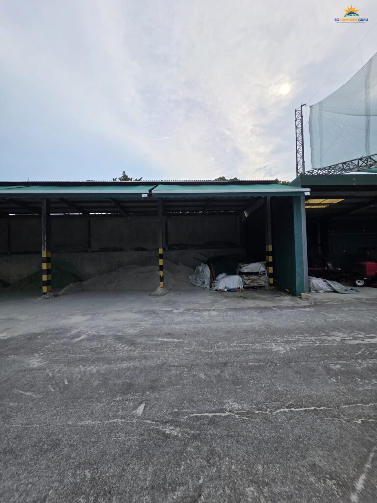 Retractable awning installed at an industrial warehouse in Singapore by SG Sunshade Guru providing sun and rain protection.
