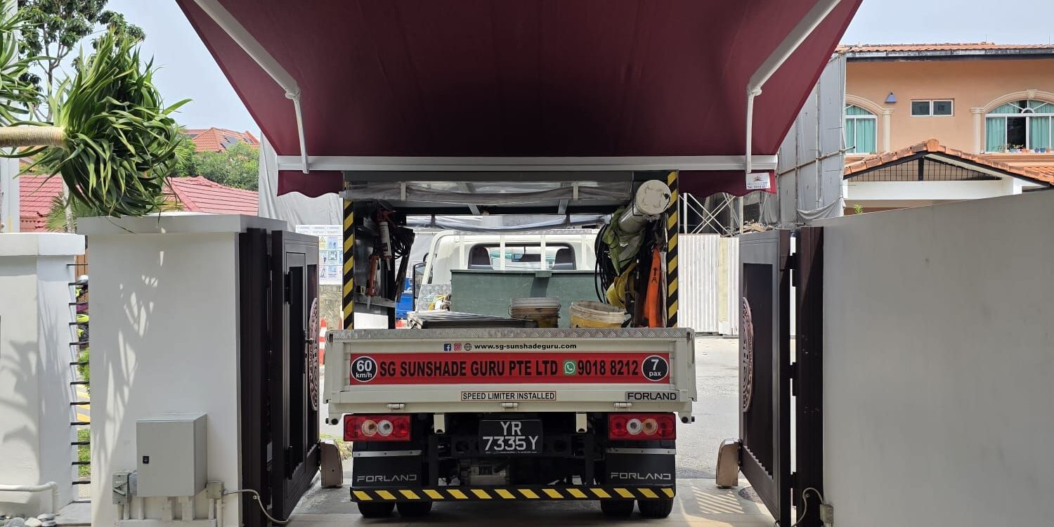 Retractable awning installed over a residential driveway in Singapore
