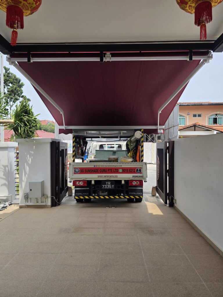 Retractable awning installed over a residential driveway in Singapore