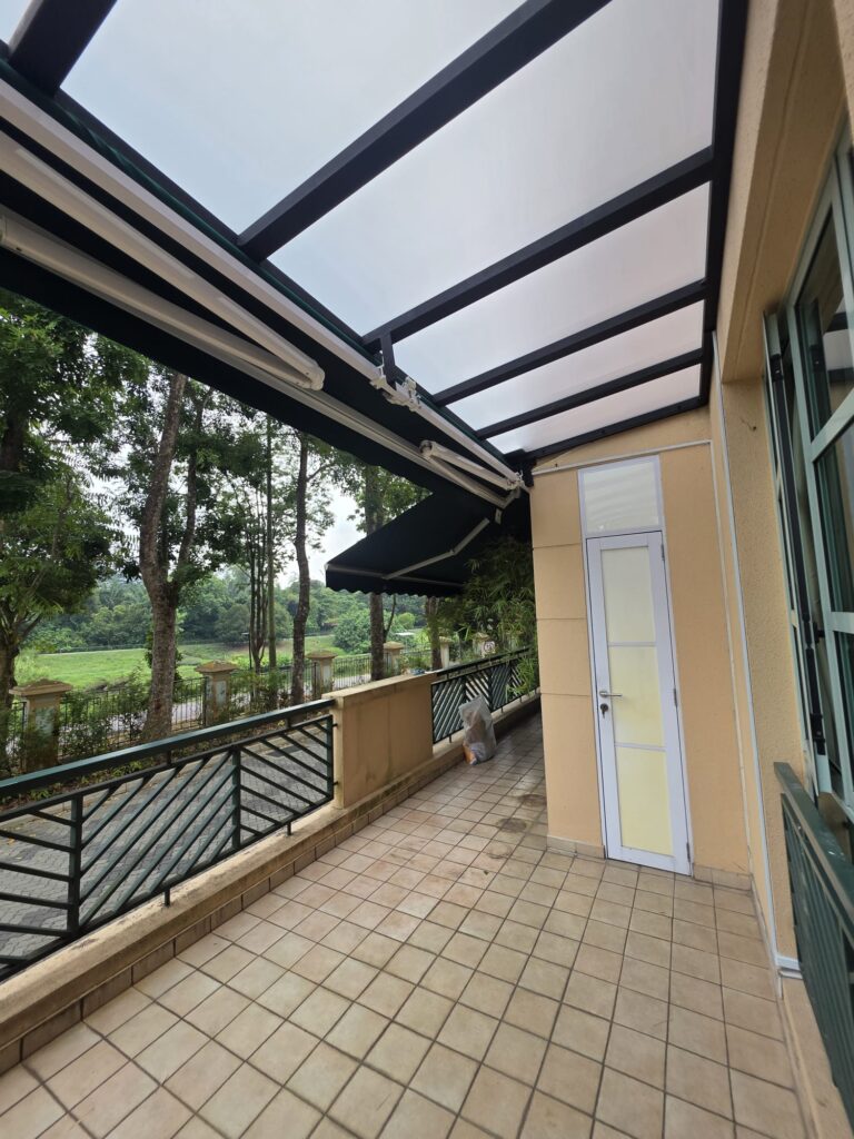 Retractable awning fitted alongside a solid frosted polycarbonate roof extension