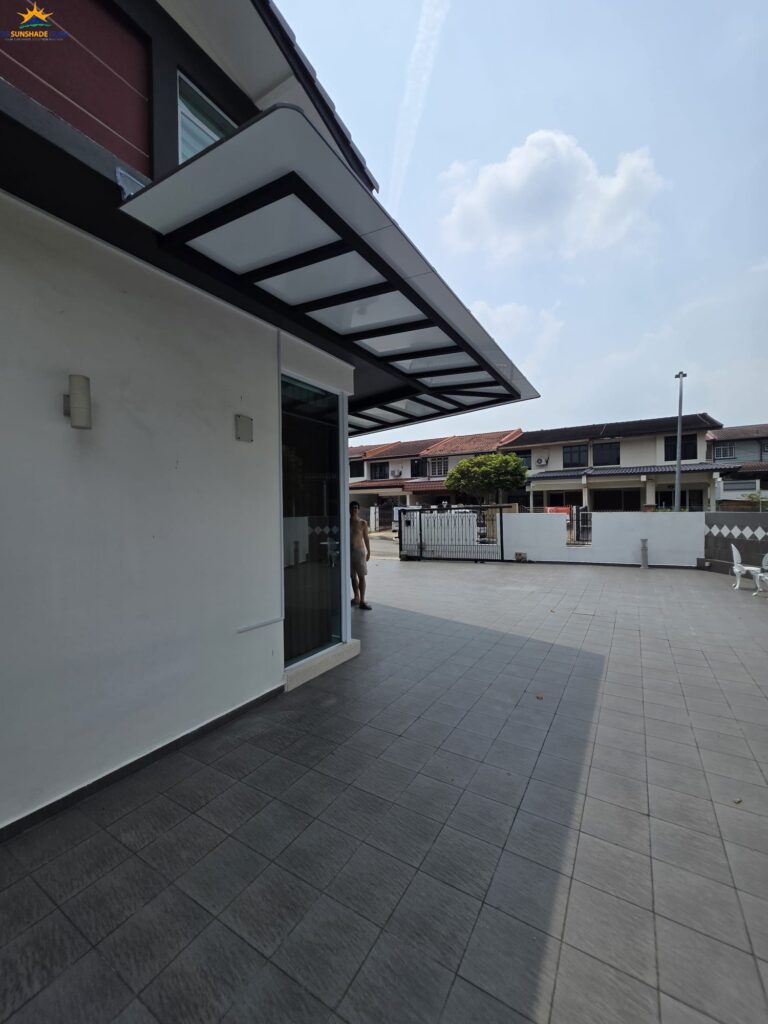 Cantilever aluminium composite roof providing shade beside a residential property in Singapore