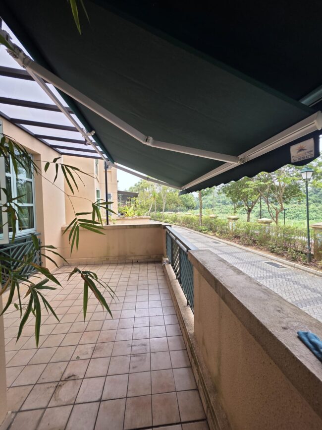 Extended retractable awning providing shade for an outdoor balcony