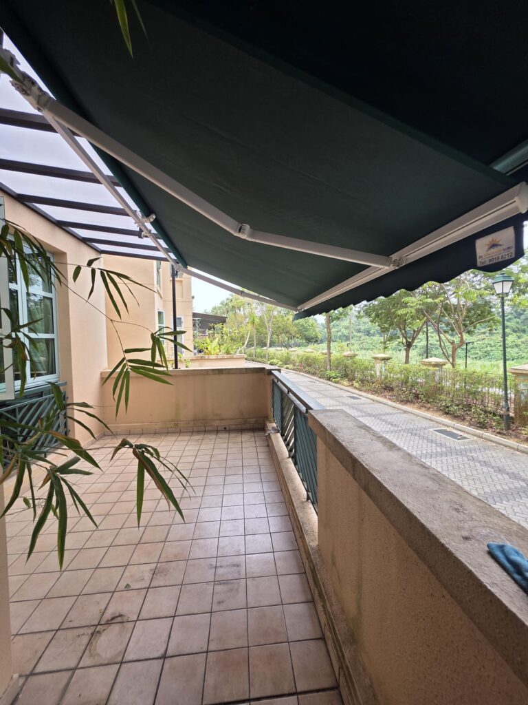 Extended retractable awning providing shade for an outdoor balcony