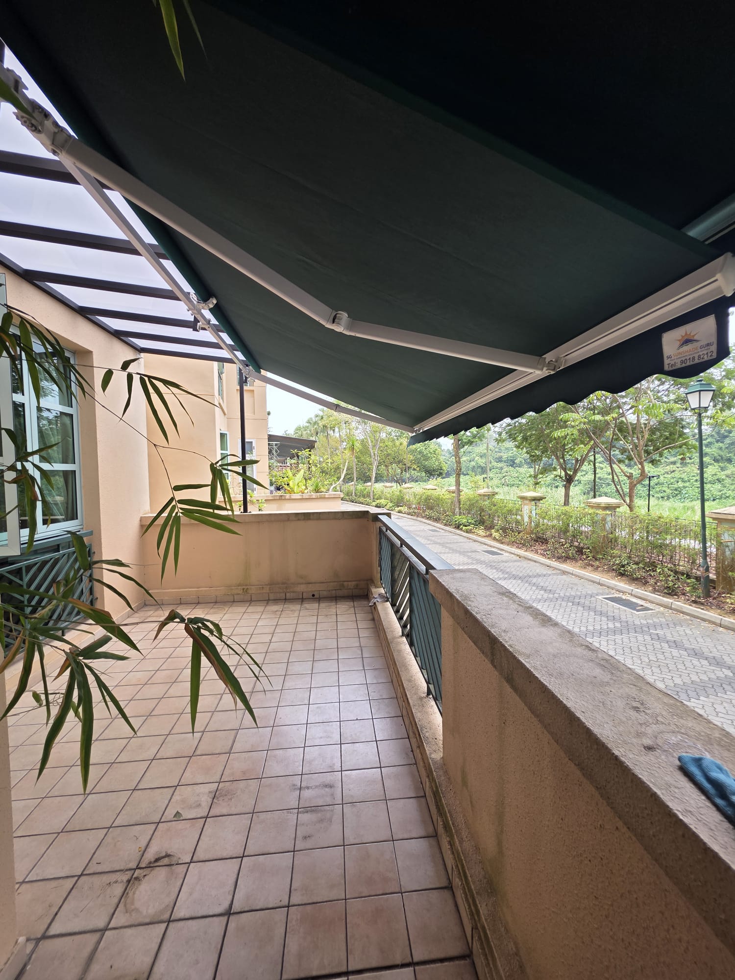 Extended retractable awning providing shade for an outdoor balcony