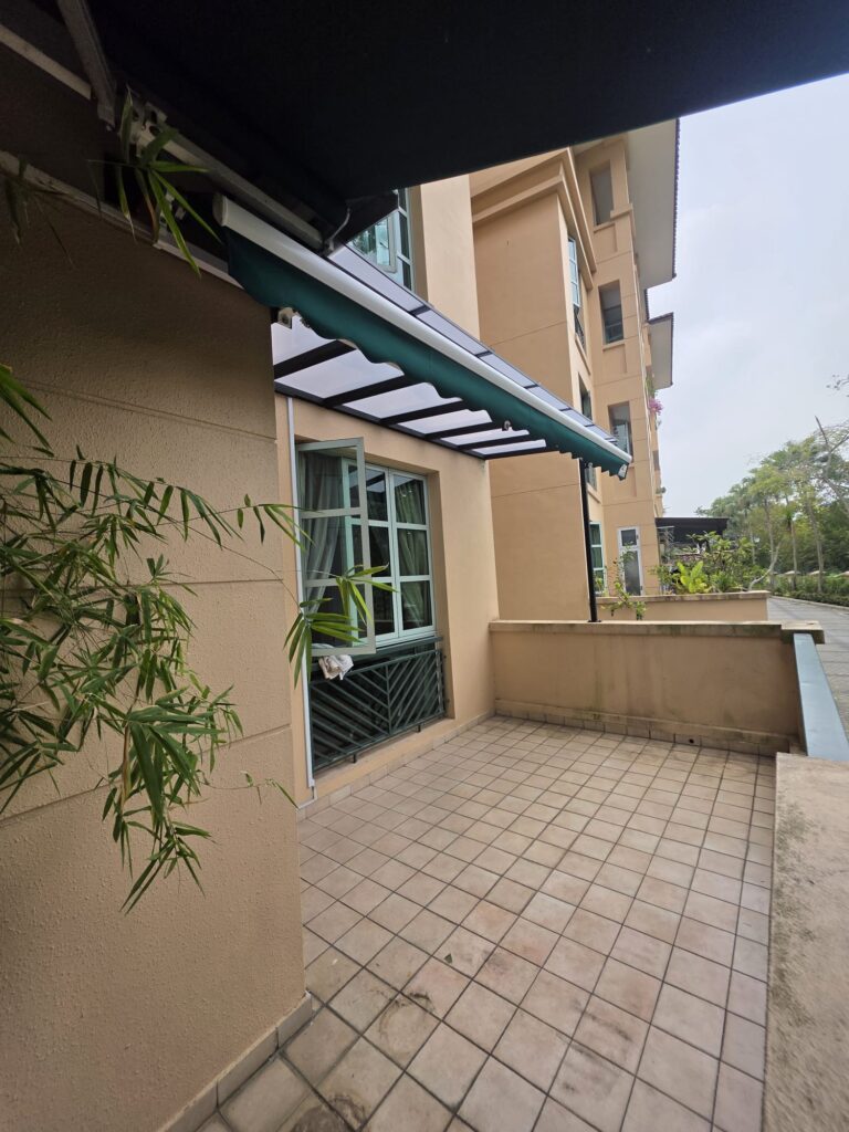 Frosted polycarbonate roof extension with retractable awning over a balcony