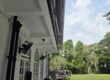 Giant awning creating shade over a large outdoor seating and entertainment space