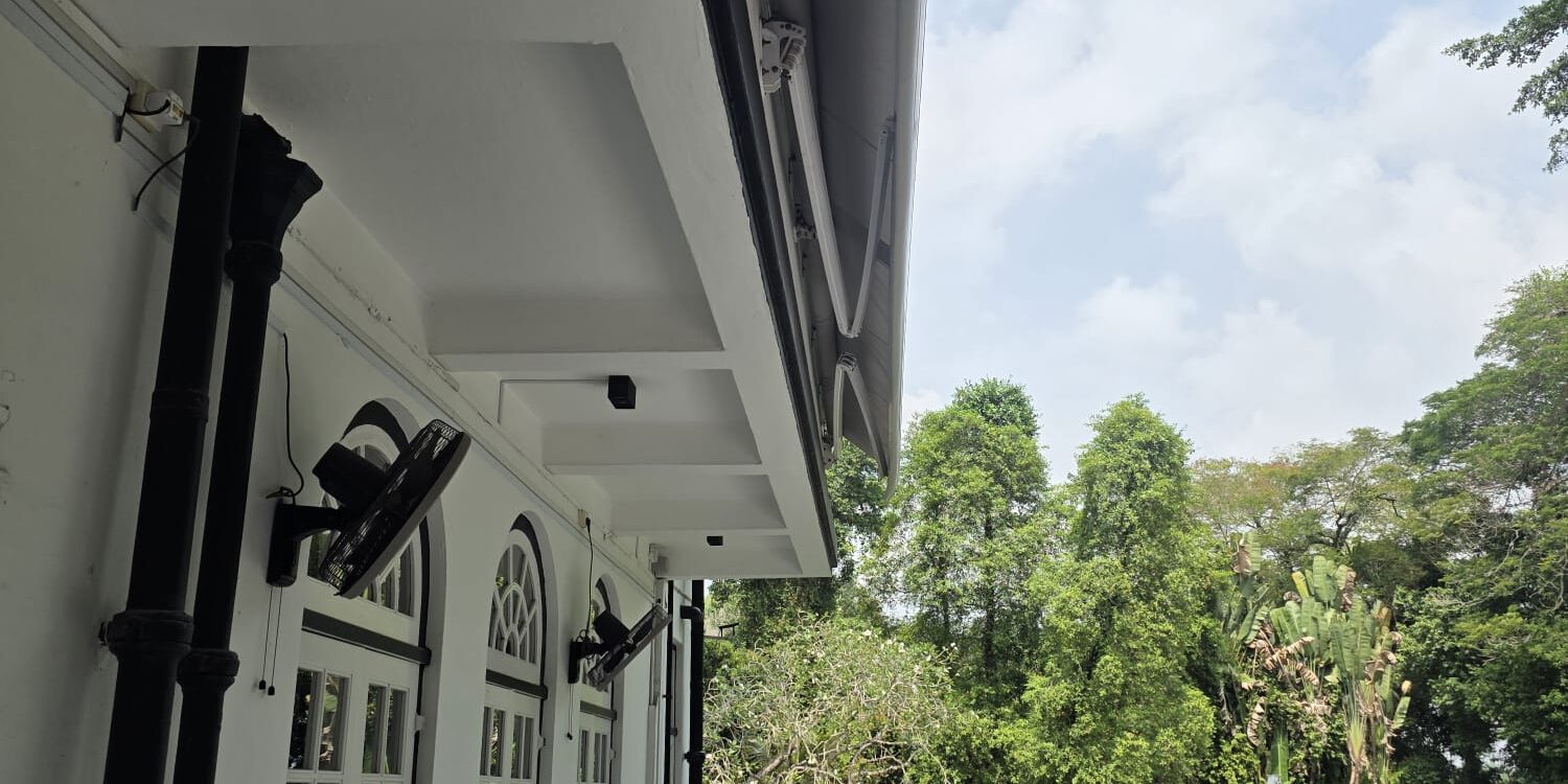 Giant awning creating shade over a large outdoor seating and entertainment space
