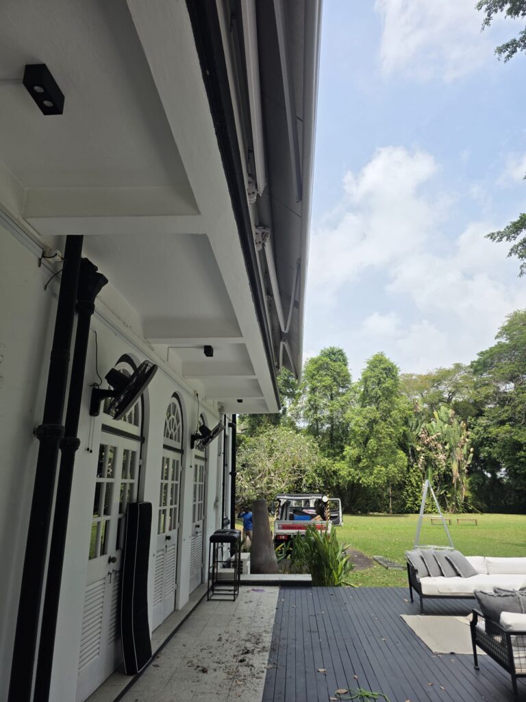 Giant awning creating shade over a large outdoor seating and entertainment space