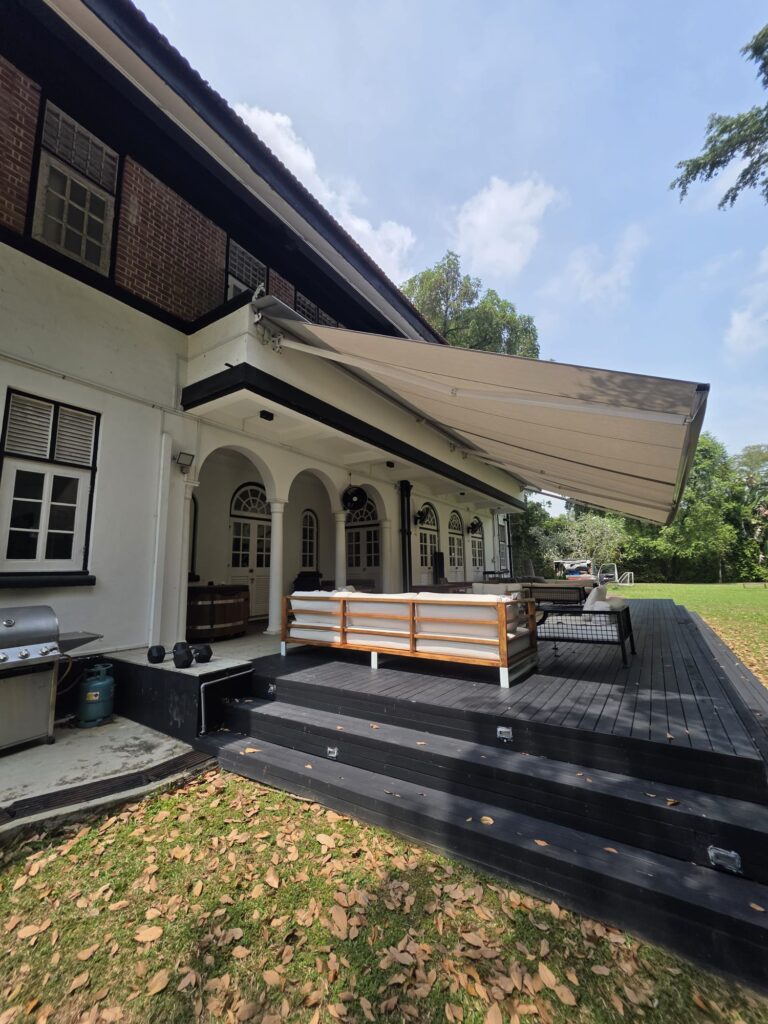 Extended patio awning covering a large outdoor seating area