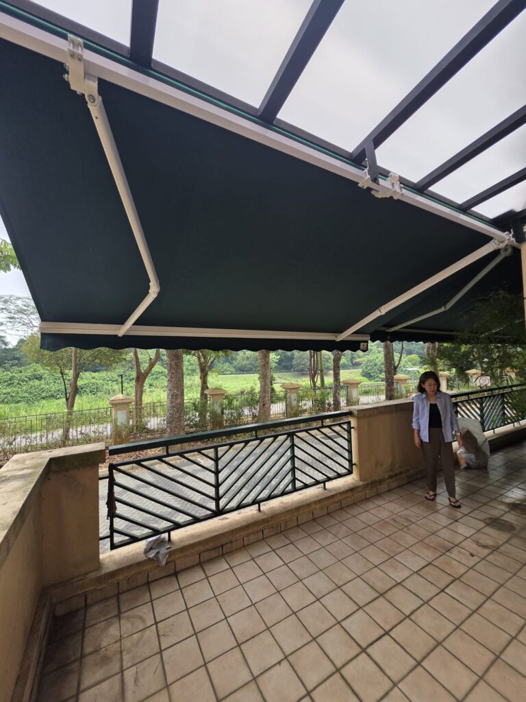 Motorised retractable awning extended over a residential balcony
