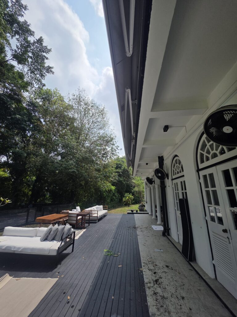 Giant retractable awning retracted above the residential patio